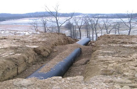 dirt trench with corrugated drainage tube