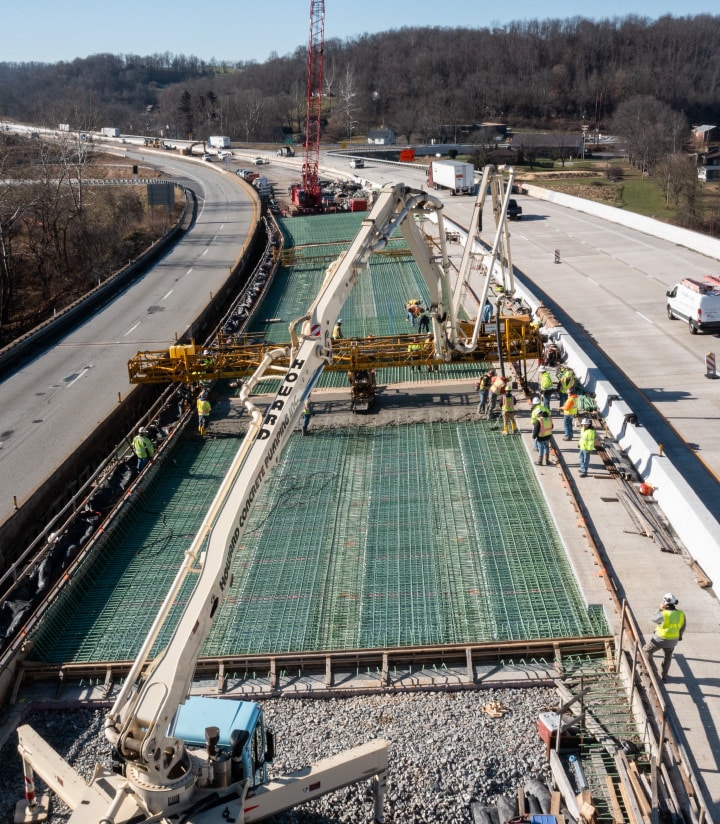 construction crew prepping roadway for concrete