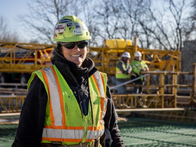 construction worker smiling at construction site